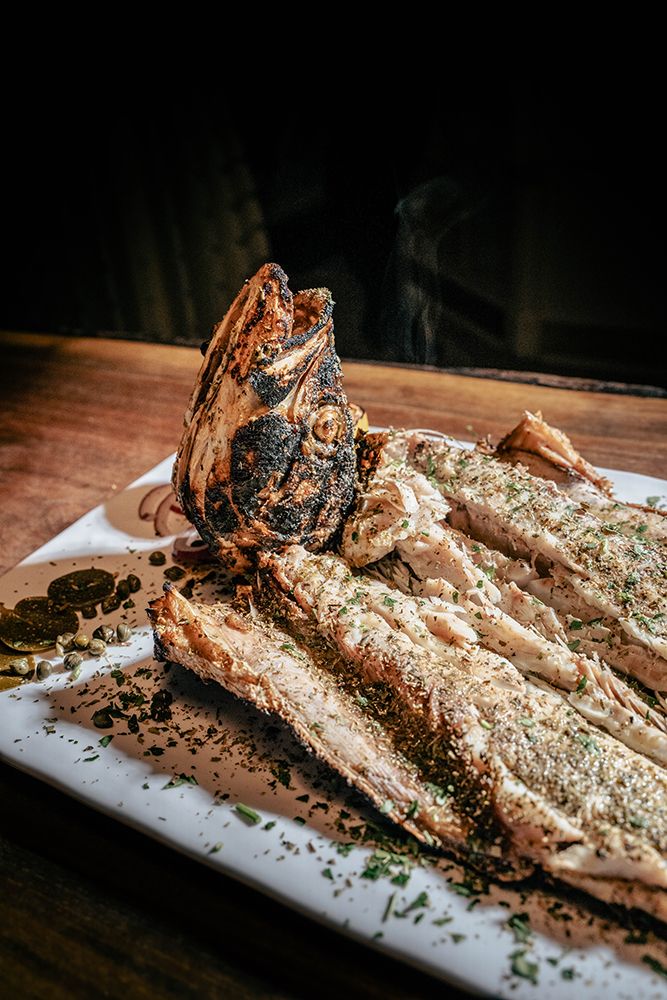 Whole grilled fish, tableside